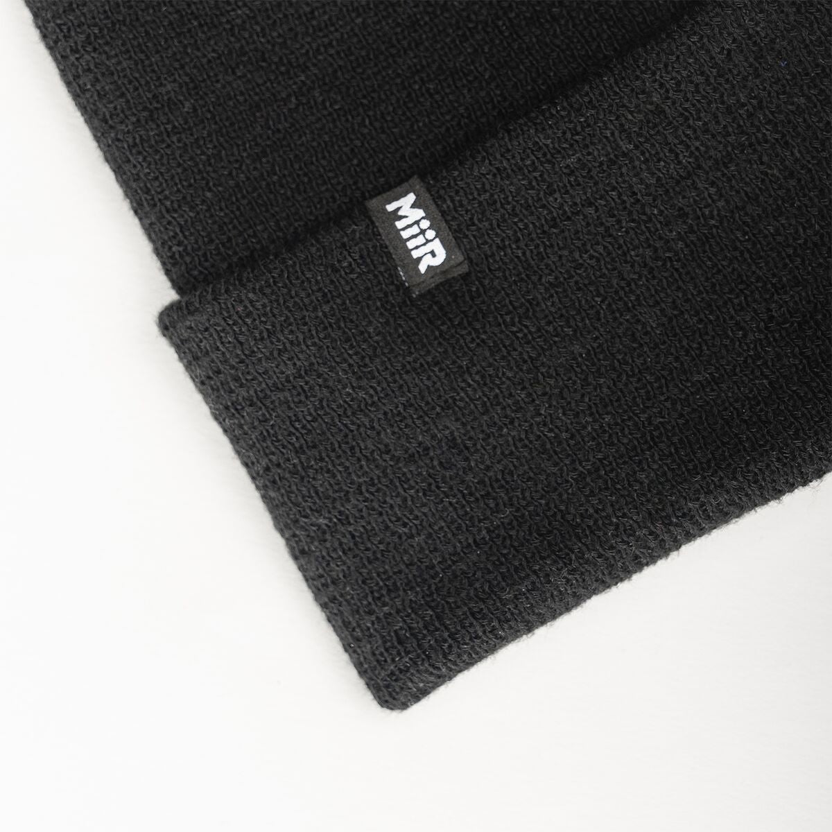 recycled-poly-fine-knit-beanie-f0 WebPDP-RecycledPolyFineKnitBeanie_Studio_TagDetail_Black__BNE005002OS.jpg