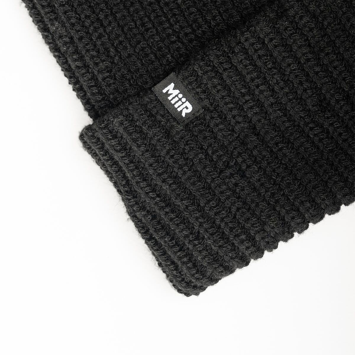 recycled-poly-rib-beanie-n0 WebPDP-RecycledPolyRibBeanie_Studio_TagDetail_Black__BNE002002OS.jpg